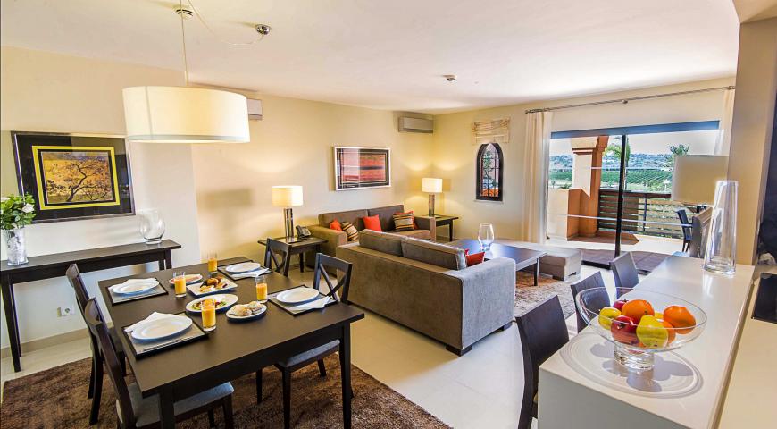 https://golftravelpeople.com/wp-content/uploads/2019/04/Amendoeira-Resort-2-bedroom-apartment.jpg
