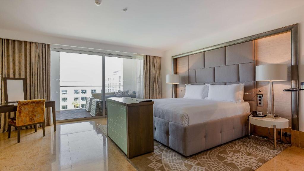 https://golftravelpeople.com/wp-content/uploads/2019/04/Conrad-Algarve-Hotel-Bedrooms-and-Suites-10.jpg