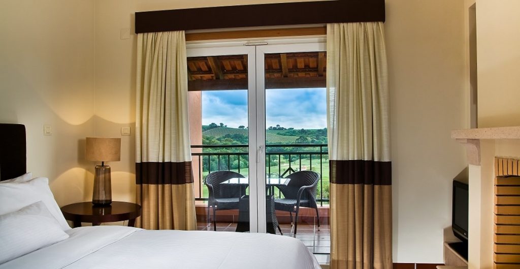 https://golftravelpeople.com/wp-content/uploads/2019/04/Dolce-Campo-Real-Resort-residences-3-bedroom-townhouses-bedroom-1024x529.jpg