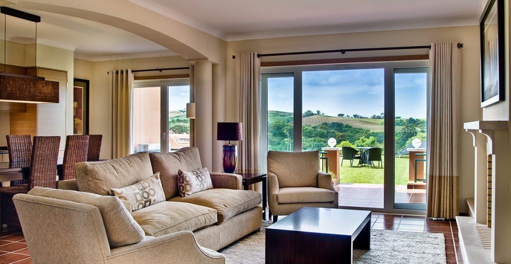 https://golftravelpeople.com/wp-content/uploads/2019/04/Dolce-Campo-Real-Resort-residences-3-bedroom-townhouses-living-room-1024x529.jpg
