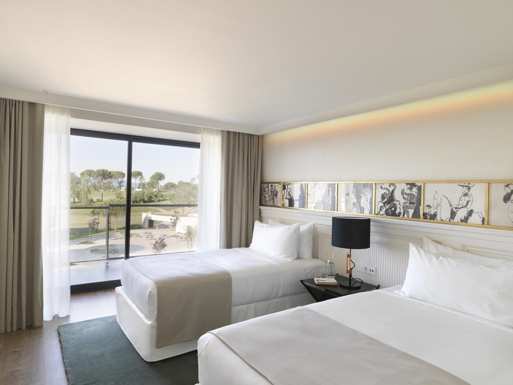 https://golftravelpeople.com/wp-content/uploads/2019/04/Hotel-Camiral-at-PGA-Catalunya-Resort-Bedrooms-1.jpg