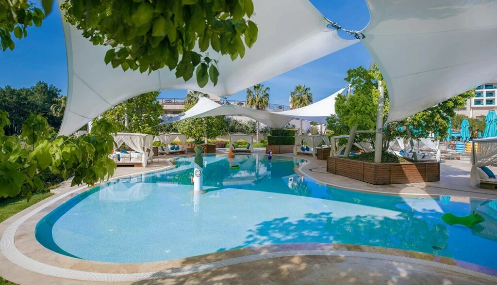 https://golftravelpeople.com/wp-content/uploads/2019/04/Regnum-Carya-Hotel-Belek-Beach-and-Swimming-Pools-10-1024x588.jpg