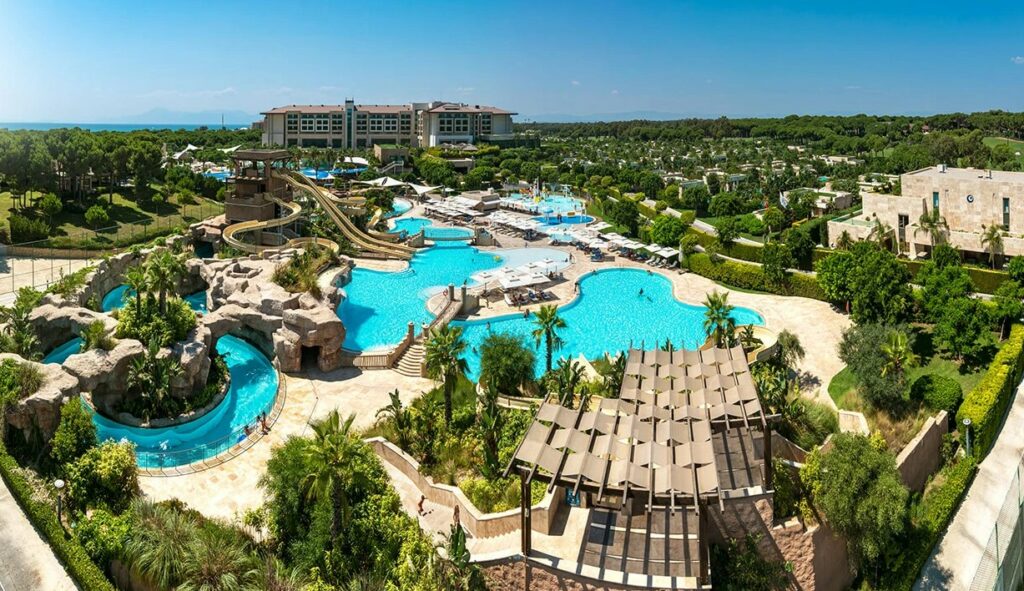 https://golftravelpeople.com/wp-content/uploads/2019/04/Regnum-Carya-Hotel-Belek-Beach-and-Swimming-Pools-11-1024x591.jpg