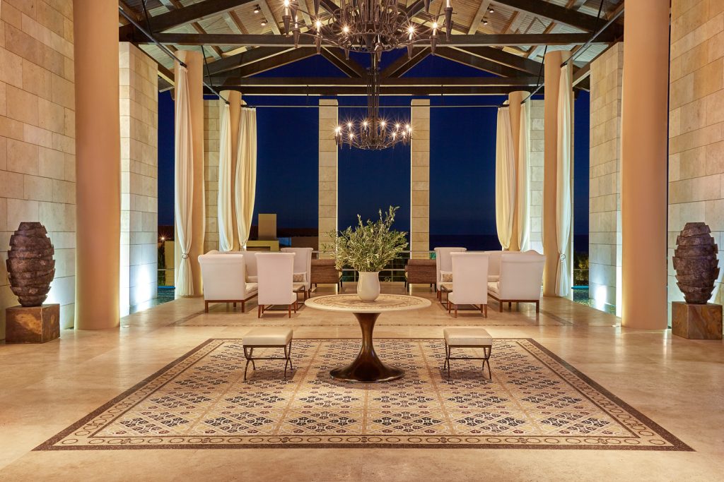https://golftravelpeople.com/wp-content/uploads/2019/04/The-Romanos-Luxury-Collection-Resort-at-Costa-Navarino-Open-air-Lobby-by-Night-1024x683.jpg