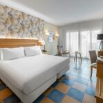 https://golftravelpeople.com/wp-content/uploads/2020/11/Elba-Sara-Beach-Golf-Resort-Fuerteventura-Bedrooms-and-Suites-1-150x150.jpg