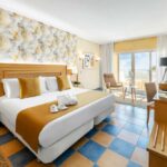 https://golftravelpeople.com/wp-content/uploads/2020/11/Elba-Sara-Beach-Golf-Resort-Fuerteventura-Bedrooms-and-Suites-4-150x150.jpg