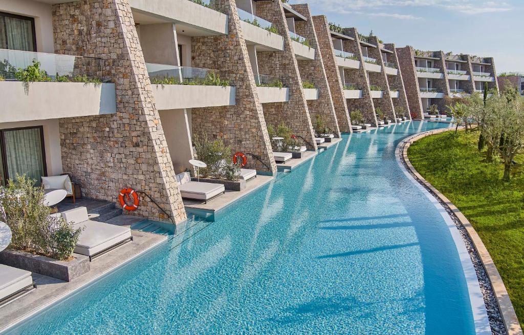 https://golftravelpeople.com/wp-content/uploads/2023/02/W-Costa-Navarino-Greece-Swimming-Pools-Leisure-Facilities-7.jpg