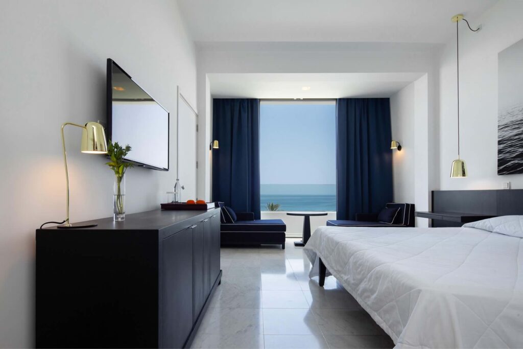https://golftravelpeople.com/wp-content/uploads/2023/07/Almyra-Hotel-Paphos-Cyprus-Bedrooms-and-Suites-5-1024x683.jpg