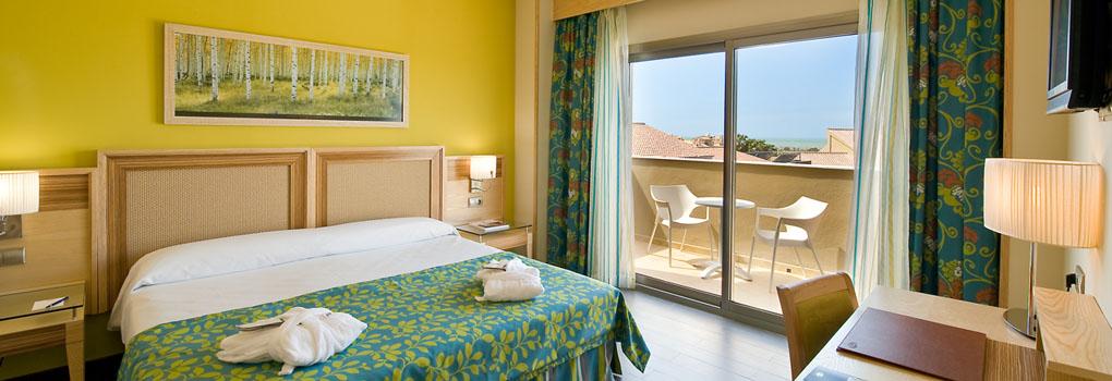 https://golftravelpeople.com/wp-content/uploads/2023/07/Elba-Costa-Ballena-Beach-and-Thalasso-Resort-Bedrooms-and-Suites-2.jpg