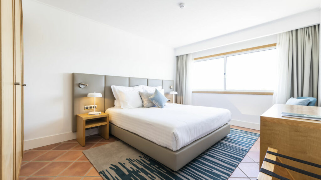 https://golftravelpeople.com/wp-content/uploads/2024/04/Patio-Suite-Hotel-Albufeira-Algarve-Portugal-Bedrooms-Apartments-Suites-1-1024x576.jpg