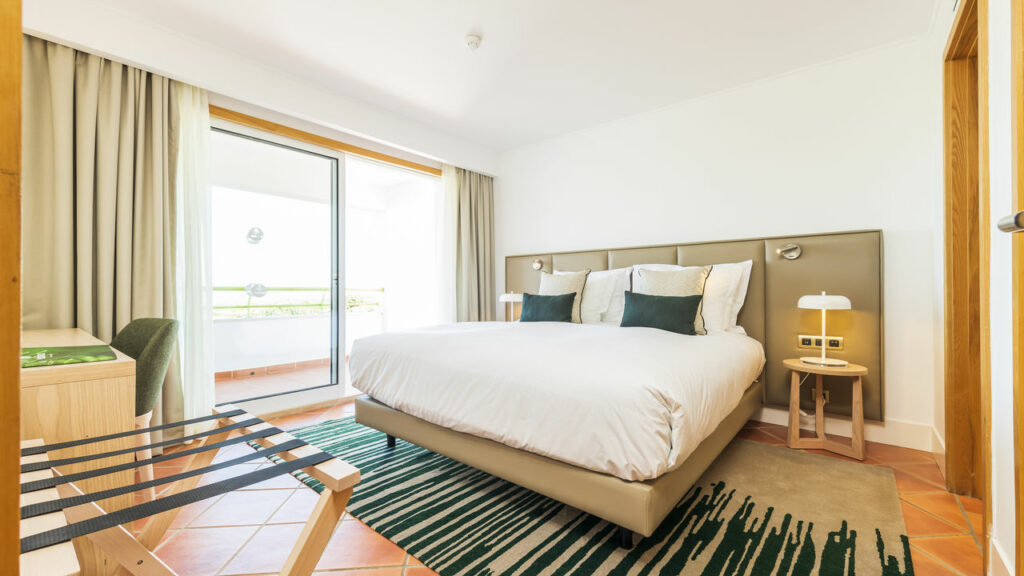 https://golftravelpeople.com/wp-content/uploads/2024/04/Patio-Suite-Hotel-Albufeira-Algarve-Portugal-Bedrooms-Apartments-Suites-17-1024x576.jpg