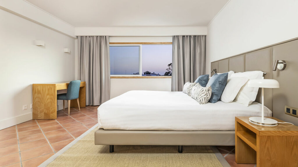 https://golftravelpeople.com/wp-content/uploads/2024/04/Patio-Suite-Hotel-Albufeira-Algarve-Portugal-Bedrooms-Apartments-Suites-19-1024x576.jpg