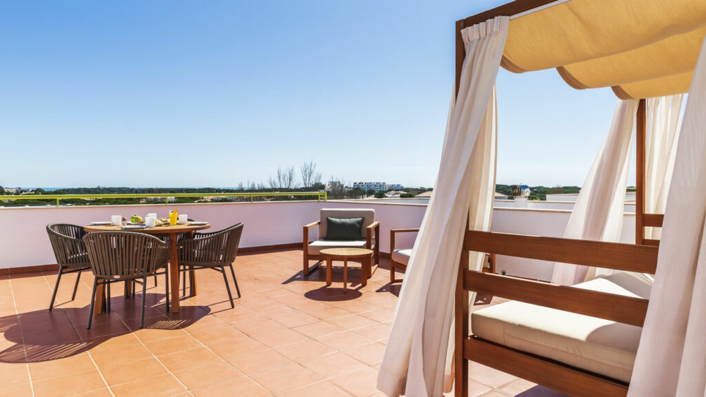 https://golftravelpeople.com/wp-content/uploads/2024/04/Patio-Suite-Hotel-Albufeira-Algarve-Portugal-Bedrooms-Apartments-Suites-2-1024x576.jpg