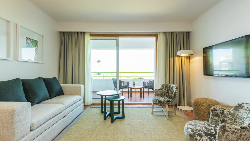https://golftravelpeople.com/wp-content/uploads/2024/04/Patio-Suite-Hotel-Albufeira-Algarve-Portugal-Bedrooms-Apartments-Suites-24-1024x576.jpg