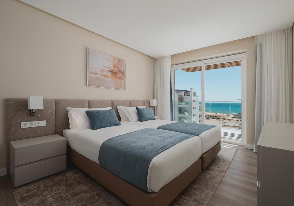https://golftravelpeople.com/wp-content/uploads/2026/01/Dom-Pedro-Residences-Vilamoura-Rooms-Apartments-Suites-14.jpg